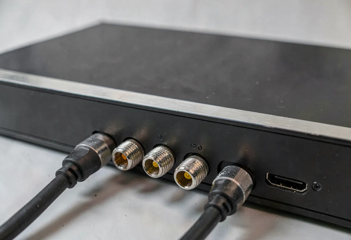 Close-up of a DVR rear panel showing BNC coaxial connectors and HDMI port